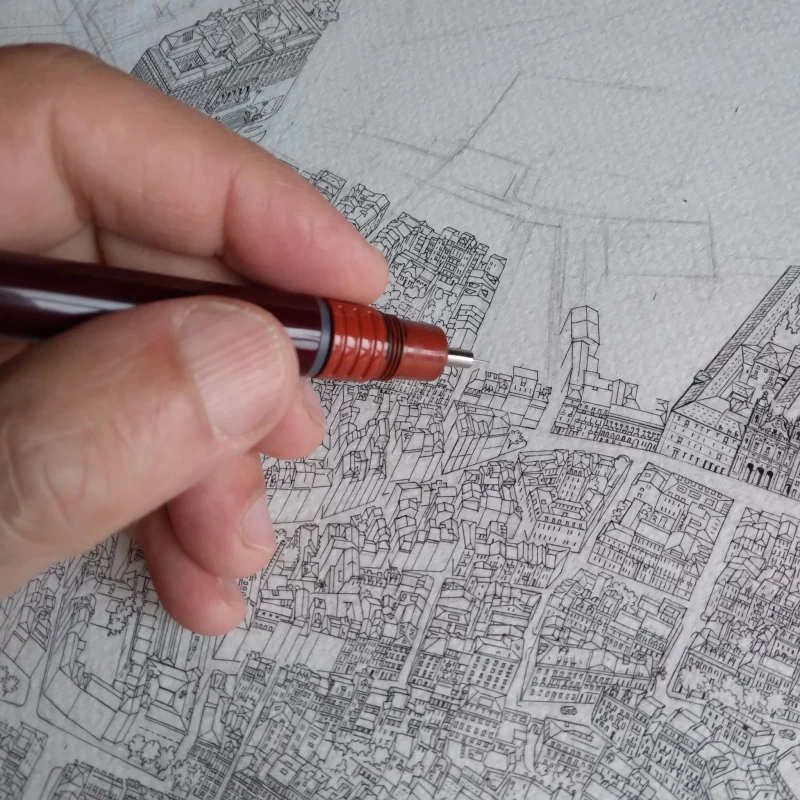 Ruben Atayan hand-inking a panoramic city map in fine liner pen